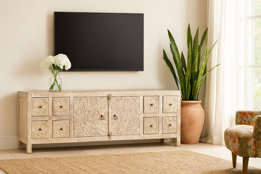 Decorative wooden cabinet with a TV above it in a living room setting.