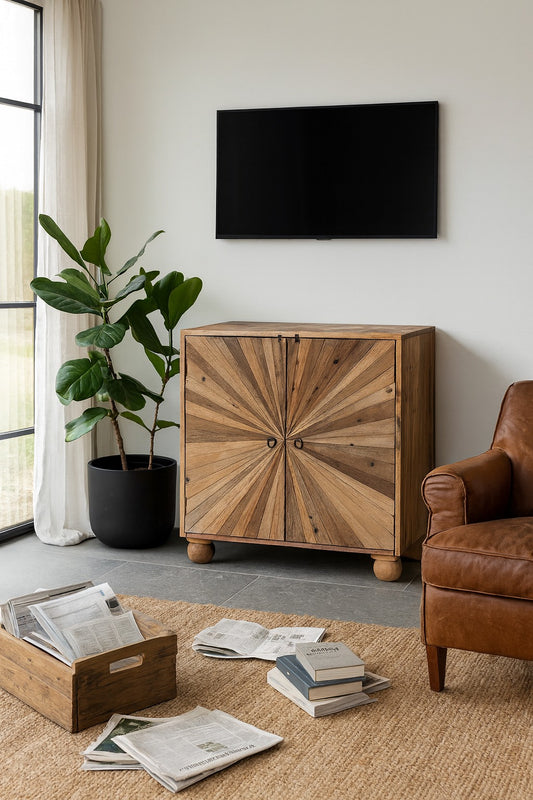Living room with wooden cabinet, brown armchair, and TV on the wall.
