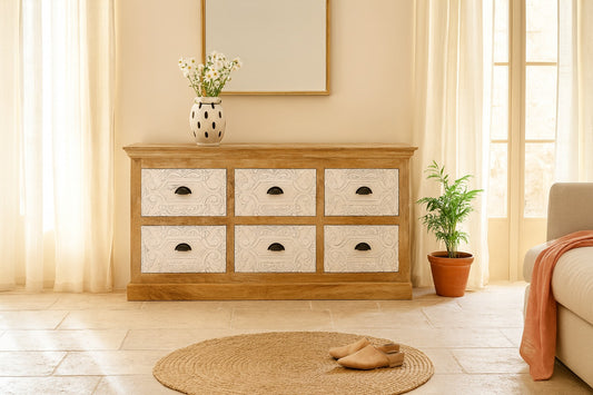 Wooden dresser with six drawers in a room with a plant and rug.